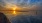 wide view of sunset's reflection on water